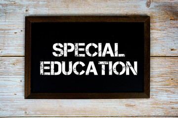 Special Education text with gift box present and alarm clock on black background