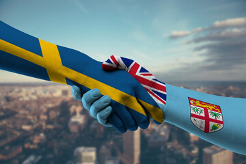 Shaking hands Sweden and Fiji
