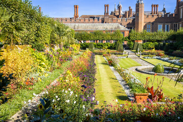 Colourful sunken pond gardens and Tudor Facade of Hampton Court Palace