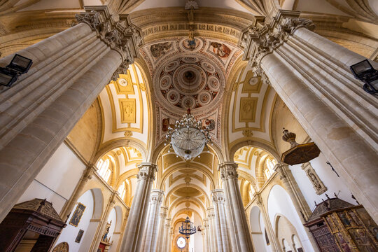 Baeza Cathedral interior showing columns, dome, and chandeliers in Andalusia, Spain