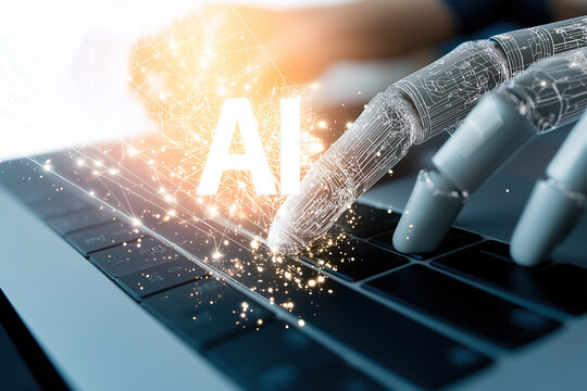 Robotic hand interacts with laptop keyboard showcasing artificial intelligence technology integration in modern automated workflows.