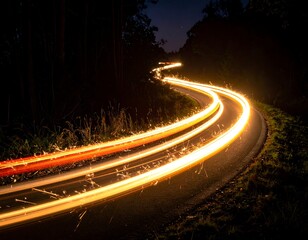 Winding road at night with light trails