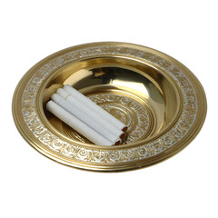 Ornate antique brass bowl with a rolled white cloth or paper inside isolated on transparent background