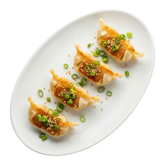 Four pan fried gyoza dumplings with green onions isolated on transparent background