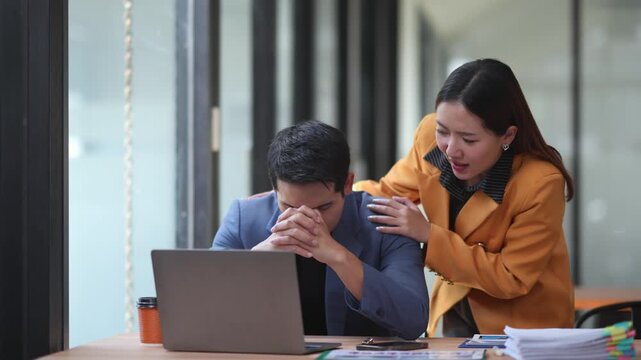 Supportive businesswoman consoling anxious coworker, displaying professional compassion during stressful office interaction