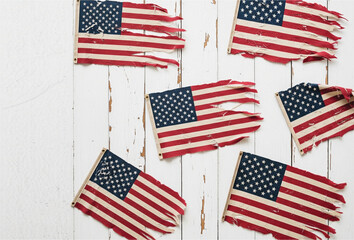 Panorama template greeting card with American flags on rustic wooden table, wood texture.  4th of July, Labor Day, Memorial Day, Veteran's Day or other patriotic celebration stock photo.