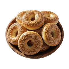 A pile of sesame bagels on a wooden plate isolated on transparent background