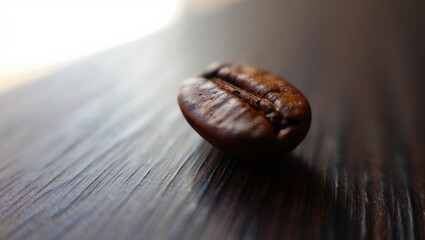 Close-Up of a Single Coffee Bean Resting on a Wooden Surface, Capturing the Rich Color and Texture of the Bean's Exterior