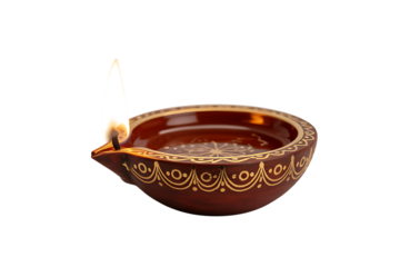 Illuminating traditional diya with warm flame casting a gentle glow, perfect for festive celebrations.