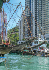 Boats and condos in Aberdeen Fishing Village, Hong Kong harbor, China