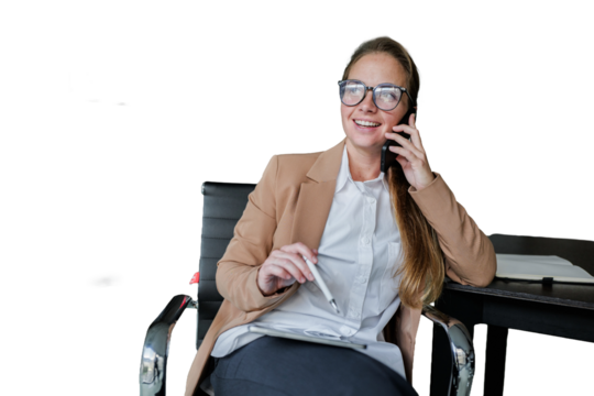 Woman smiling while talking on cell phone in office