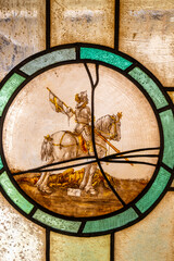 Knight defeating dragon stained glass window in Svihov, Czechia