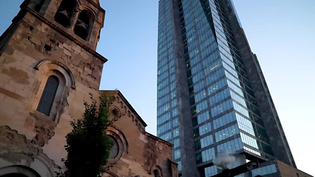 Ancient weathered stone church stands resiliently against sleek glass and steel skyscraper, a powerful juxtaposition of old and new urban architecture.