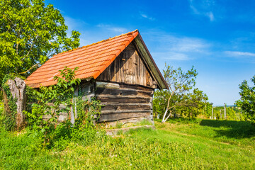 Obraz premium Historic wooden cottages street in Stare Obreske kleti, Kalnik, Prigorje region of Croatia 