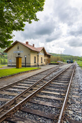 Obraz premium Zubrnice Train Station in Czechia on Cloudy Day