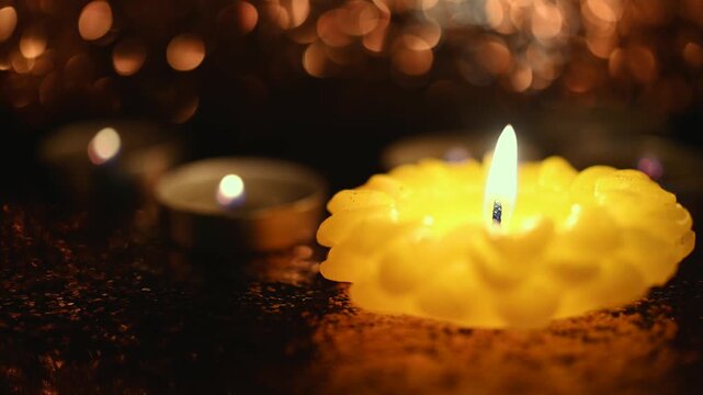 All Hallows' Day. Solemnity of All Saints. All Saints' Day greeting banner with bokeh effect.  Candles with fire on shiny background