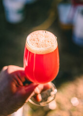 Gathering at sunset while enjoying a refreshing fruity drink in a vibrant setting outdoors