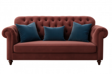 Red chesterfield sofa with blue pillows isolated on transparent background, perfect for interior design projects
