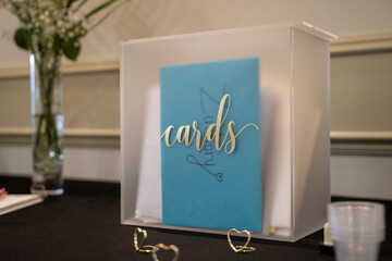 Wedding card box with envelopes on table.