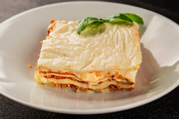 Lasagna bolognese béchamel sauce, meat, cheese second course tasty snack fresh delicious gourmet food background on the table rustic food top view copy space