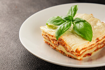 Lasagna bolognese béchamel sauce, meat, cheese second course tasty snack fresh delicious gourmet food background on the table rustic food top view copy space