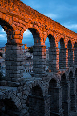 Roman aqueduct of Segovia at sunset, Spain
