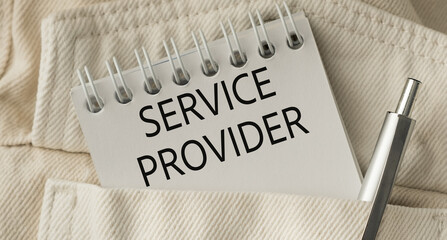 A pen is sitting on top of a notebook that says Service Provider