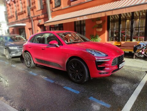 Moscow, Russia - September 14, 2025: The red Porsche Macan is a compact premium sports crossover. It features a dynamic coupe-style design, powerful powertrains, and a sporty chas