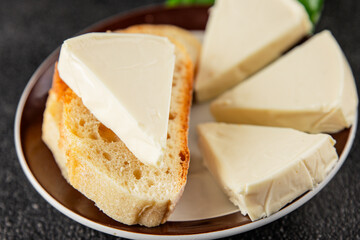 Processed cheese spread portion size cheese for sandwich tasty snack fresh delicious gourmet food background on the table rustic food top view copy space