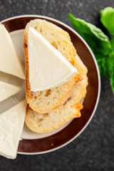 Processed cheese spread portion size cheese for sandwich tasty snack fresh delicious gourmet food background on the table rustic food top view copy space