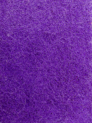 Close up of purple textured fiber surface background