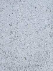 Close up of rough white concrete wall texture with small pores