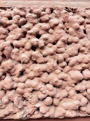 The texture of hardened clay in beige tones 