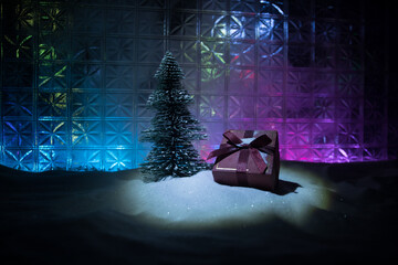 Christmas home decoration with snow and tree on a dark background with copy space. Selective focus. New Year attributes on background