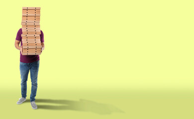 Naklejka premium Man holding many pizza boxes against light green background. Banner design with space for text