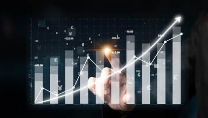 Dynamic digital graph displaying upward trends with data points and hands interacting with the...
