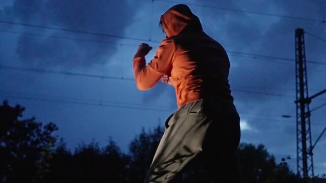 Dynamic Urban Training at Dusk Engage in Fitness Activities with Energy in Motion
