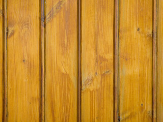 Fototapeta premium Close up of vertical wooden planks with natural yellow brown texture