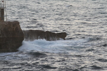 waves crashing on rocks
