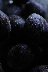 Fresh plums with water drops, organic fruit, healthy food