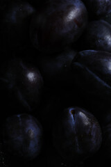 Fresh plums with water drops, organic fruit, healthy food