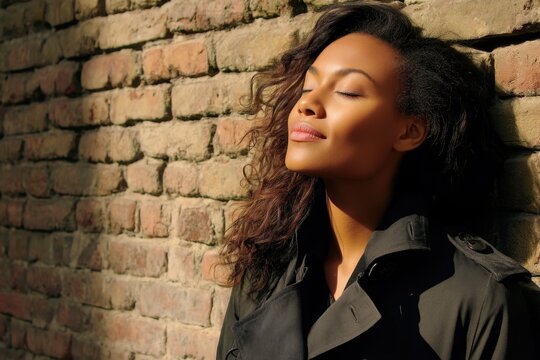 Contemplative Woman Leaning Against Wall