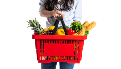 A woman holding a vibrant red basket filled with fresh groceries