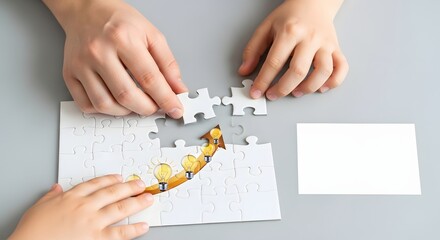 Close up of two pairs of hands working together to assemble a jigsaw puzzle on a gray surface showing teamwork and problem solving