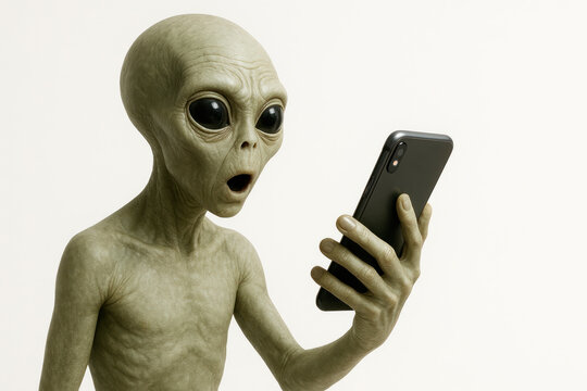 The alien looks at the smartphone in surprise. Space for text.