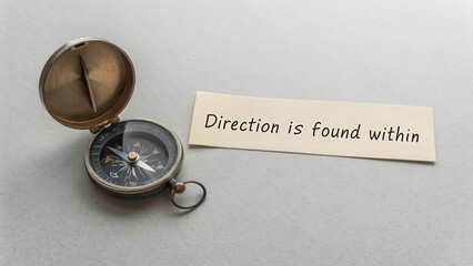 Vintage Compass on Table with Inspirational Message About Direction
