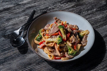 Pasta with beef, mushrooms and vegetables. 