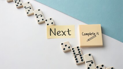 Fototapeta na wymiar Dominoes and Note Concept for Planning and Organization Attempt