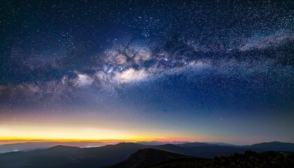 Fototapeta premium A Serene Night Scene With The Milky Way Shining Over The Horizon Blending Tranquility And Vastness Ideal For Commercial Backgrounds