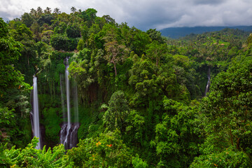 Stunning view of Sekumpul waterfall surrounded by lush jungle, Bali, Indonesia